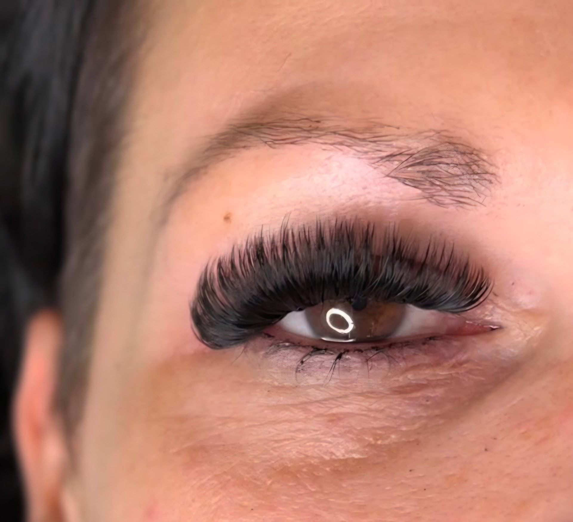 Close-up of mega volume lash extensions showing dramatic full fluffy lashes at Ash's Lashes and Esthetics