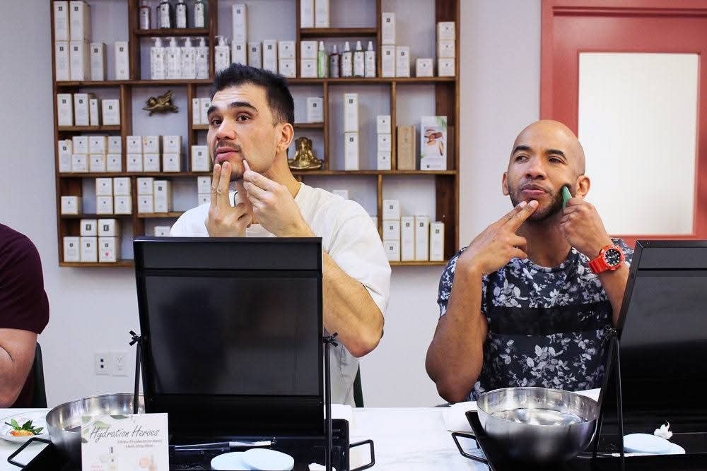 Two guests applying skincare products during a You Dew You guided facial event at Ash's Lashes